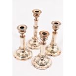 A set of four early 19th Century Old Sheffield Plate extending candlesticks,