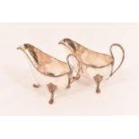 A pair of 18th Century Old Sheffield Plate Gravy boats, standing on three paw feet with loop handle,