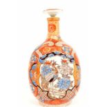A good late 19th Century Meiji period Japanese wine flagon or bottle, in the Imari palette with