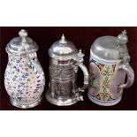 Two pottery and pewter mounted steins and one other plated example.