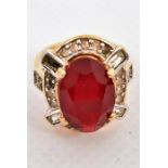 A costume jewellery gold plated and red stone dress ring