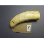 A 19th Century scrimshaw tusk carved wit