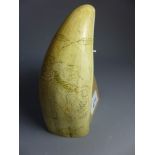 A 19th century Scrimshaw tusk carved wit