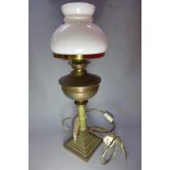 A 19th century brass oil lamp with Corin