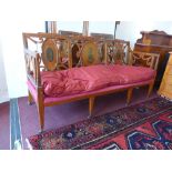 A late 19th Century French satinwood three seater sofa,