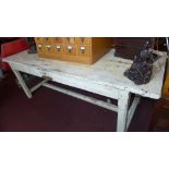 An antique painted and distressed French pine farmhouse table, having plank top,