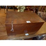 An 18th Century wooden box with a carved lid and sides.