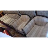 A French Art Deco four piece suite upholstered ivory fabric, consisting of a three piece sofa,