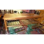 A mid 20th Century teak rectangular low table with slatted undertier