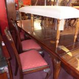 A set of eight early 20th Century Chippendale style dining chairs with pierced back rests,