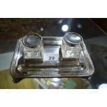 An Edwardian silver inkstand with original silver mounted glass ink pots,