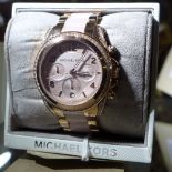 A Michael Kors ladies wristwatch in original box.