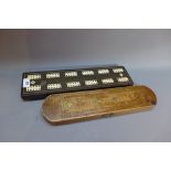 A 19th Century ebonised and ivory cribbage board L-41cm,