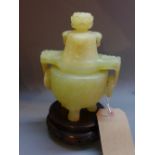 A Chinese twin handled Jadeite Koro carv