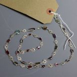 A silver and mixed stone cabouchon necklace including tourmaline and garnet