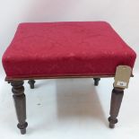 A 19th Century rosewood foot stool with red floral upholstery, raised on fluted legs.