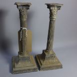 Apair of early 20th Century Corinthian column silver candlesticks,