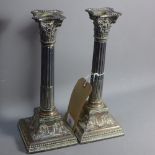 A pair of late Victorian Corinthian column silver candlesticks by James Dixon & Son.