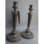 A pair of late 18th Century Birmingham silver candlesticks by maker Matthew Boulton, dated 1783.