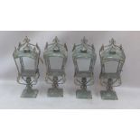 A set of four blue painted storm lanterns