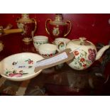 Four pieces of 19th Century cream ware to include two cups and a tea bowl and saucer,