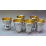 Six French silver small cups, embossed border and gilt washed interior, H.4.