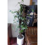 A contemporary faux tree in white ceramic planter,