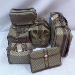 A collection of vintage Gucci luggage in monogram design comprising of eleven pieces including