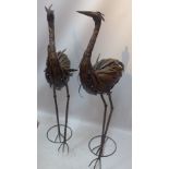 A pair of sheet metal garden storks