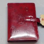 A gentlemen's Cartier filofax having leather monogram cover in deep maroon