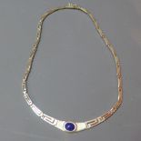 A silver and lapis lazuli bib necklace, with Greek key link chain,