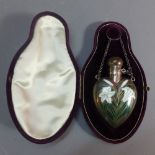 A Victorian silver chataleine scent bottle having enamel lily floral design to front in velvet