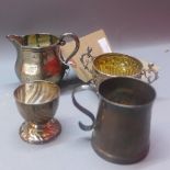 A collection of silver comprising a jug, twin handle cup,