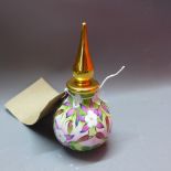 A Moorcroft enamelled porcelain scent bottle decorated with flowers.