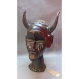 An African tribal leather Janus head with horns H-53cm