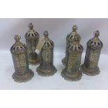 A set of six brass storm lanterns