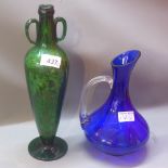 A Victorian green glass twin handled bottle,