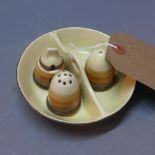 A Clarice Cliff hand painted cruet set on stand in colours of cream and brown.