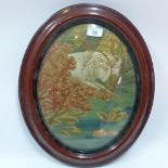 A 19th Century oval stump work of a ram in a woodland scene,