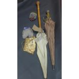 Two vintage parasols and a collection of purses