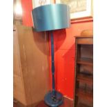 A contemporary blue painted standard lamp.