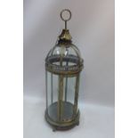 A gilt metal dome top storm lantern