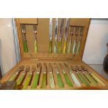 A 19th Century part canteen of sliver plated fruit knives and forks by West and Son of Dublin,