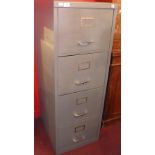 A metal four draw office filing cabinet 131cm in height.