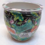 A large Chinese famille noir jardiniere decorated with ducks on a pond with gold fish interior,