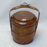 A Chinese lacquered two section food carrier