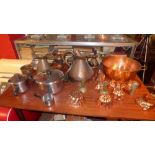 A collection of copper to include jugs,