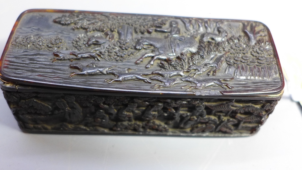 An 18th Century Chinese carved tortoiseshell trinket box. The top carved with a hunting scene.