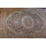 A Chinese silk carpet, floral medallion and ground to centre, fringed,