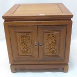 A Chinese hardwood bedside cabinet,